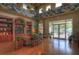 Beautifully decorated lounge area with hardwood floors and pool view at 20606 Whitewood Way, Tampa, FL 33647