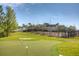 Manicured putting green with sand trap and playground nearby at 20606 Whitewood Way, Tampa, FL 33647