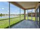Enjoy serene lake views from the comfort of this screened-in porch at 20606 Whitewood Way, Tampa, FL 33647