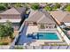 Bird's-eye view of a private backyard featuring a pool, spa, patio, and meticulously landscaped yard, enclosed by a fence at 2127 Landside Dr, Valrico, FL 33594