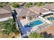 Aerial view highlighting the home's backyard, complete with a pool, spa, patio, and well-manicured landscaping, within a fenced yard at 2127 Landside Dr, Valrico, FL 33594