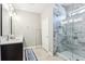 Bathroom featuring a glass shower, single vanity and modern fixtures at 2127 Landside Dr, Valrico, FL 33594