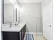 Bathroom with a dual sink vanity, stylish fixtures, and a decorative ladder at 2127 Landside Dr, Valrico, FL 33594