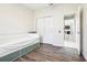 Bedroom features wood-look floors, and a closet with sliding doors at 2127 Landside Dr, Valrico, FL 33594