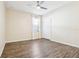 Bedroom with wood-look floors and a closet with sliding doors at 2127 Landside Dr, Valrico, FL 33594