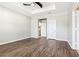 Bright bedroom with hardwood floors, tray ceiling, and neutral paint at 2127 Landside Dr, Valrico, FL 33594