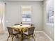Cozy dining area with a round table and seating for four near a bright window at 2127 Landside Dr, Valrico, FL 33594