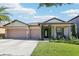 Charming single-Gathering home featuring a three-car garage and well-maintained landscaping at 2127 Landside Dr, Valrico, FL 33594