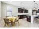 Spacious eat-in kitchen with stylish dark cabinets, stainless appliances, and an island with bar seating at 2127 Landside Dr, Valrico, FL 33594