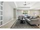 Bright living room featuring tile floors, stylish rug, and sliding glass doors to backyard at 2127 Landside Dr, Valrico, FL 33594