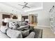 Open-concept living area with view of kitchen, featuring plush sofas and decorative accents at 2127 Landside Dr, Valrico, FL 33594