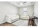 Living room with hardwood floors, a ceiling fan, and comfortable white seating at 2127 Landside Dr, Valrico, FL 33594