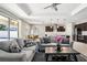 Elegant living room with modern furnishings, tray ceiling, and open floor plan at 2127 Landside Dr, Valrico, FL 33594