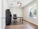 Well-lit office with hardwood floors, a large desk, and a comfortable chair at 2127 Landside Dr, Valrico, FL 33594