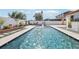 Sparkling in-ground pool with water fountain and landscaped surroundings, perfect for relaxation and outdoor enjoyment at 2127 Landside Dr, Valrico, FL 33594