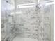 Modern glass enclosed shower with white and gray tile at 2127 Landside Dr, Valrico, FL 33594