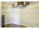Walk-in closet featuring wire shelving for ample storage space and dark wood floors at 2127 Landside Dr, Valrico, FL 33594