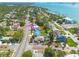Waterfront community featuring lush trees, manicured lawns, and stunning views of the bay at 225 Cevera Dr, Dunedin, FL 34698