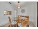 Cozy dining area with decorative light fixture and stylish decor at 225 Cevera Dr, Dunedin, FL 34698