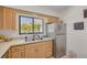 Bright kitchen featuring a stainless steel refrigerator and modern faucet at 225 Cevera Dr, Dunedin, FL 34698
