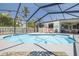 Backyard swimming pool with well-maintained pool deck, lounge chairs, and tropical landscaping at 225 Cevera Dr, Dunedin, FL 34698