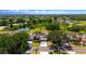 Aerial view of a neighborhood showcasing mature trees, ponds and well-manicured lawns at 2333 Brookfield Greens Cir, Sun City Center, FL 33573