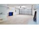 Spacious garage features epoxy flooring and plenty of room for parking and storage at 2333 Brookfield Greens Cir, Sun City Center, FL 33573