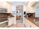 Updated kitchen showcasing granite countertops, stainless steel appliances, and wood-look floors at 2435 Comerwood Dr, Spring Hill, FL 34609