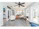 Bright sitting room with unique decor, tile floors and a view to outside patio at 2435 Comerwood Dr, Spring Hill, FL 34609