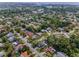 Aerial view displaying the neighborhood's layout, highlighting the abundance of trees, community lakes and ponds at 2486 Indian E Trl, Palm Harbor, FL 34683