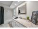 Bathroom featuring a granite countertop vanity, and shower with stylish fixtures at 2486 Indian E Trl, Palm Harbor, FL 34683