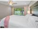 This bedroom features an outdoor view and a ceiling fan at 2486 Indian E Trl, Palm Harbor, FL 34683
