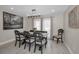 Charming dining room with rustic table, decorative chandelier, and a large picturesque window for natural light at 2486 Indian E Trl, Palm Harbor, FL 34683
