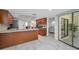 Well-equipped kitchen with wood cabinets, stainless appliances and a breakfast bar at 2486 Indian E Trl, Palm Harbor, FL 34683