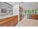 Open kitchen layout, featuring granite counters, wood cabinets, and stainless appliances, perfect for modern living at 2486 Indian E Trl, Palm Harbor, FL 34683