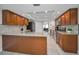 Spacious kitchen with wood cabinets, granite countertops, and stainless steel appliances, ideal for cooking at 2486 Indian E Trl, Palm Harbor, FL 34683
