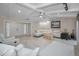 Bright living room with vaulted ceilings, stylish white furniture, and elegant decor with access to front door at 2486 Indian E Trl, Palm Harbor, FL 34683