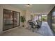 Covered patio with stylish outdoor furniture, ideal for relaxing and entertaining in style at 2486 Indian E Trl, Palm Harbor, FL 34683
