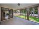 Spacious screened porch overlooking a well-maintained yard at 2486 Indian E Trl, Palm Harbor, FL 34683