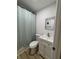 Clean bathroom with modern vanity, toilet, and bathtub/shower combination at 24862 Us Highway 19 N # 2303, Clearwater, FL 33763