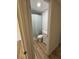 Bright bathroom featuring wood-look floors, a shower-tub combo and a single sink vanity at 24862 Us Highway 19 N # 2303, Clearwater, FL 33763