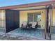 A covered lanai with a seating area, a ceiling fan, and an exit to the backyard at 24862 Us Highway 19 N # 2303, Clearwater, FL 33763