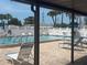 Relaxing pool area with lounge chairs and a pristine pool, perfect for enjoying sunny days in a tranquil setting at 24862 Us Highway 19 N # 2303, Clearwater, FL 33763