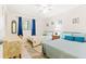 Bright bedroom with two twin beds, white walls and beach-themed decor at 251 Dunbridge Dr, Palm Harbor, FL 34684