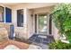 Welcoming front porch with a charming welcome sign and decorative accents at 251 Dunbridge Dr, Palm Harbor, FL 34684