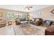 Cozy living room featuring comfortable seating, neutral tones, and ample natural light at 251 Dunbridge Dr, Palm Harbor, FL 34684
