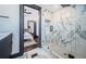Stylish bathroom with glass enclosed shower, marble tiling, and modern fixtures at 2536 Burlington N Ave, St Petersburg, FL 33713