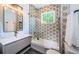 Updated bathroom featuring modern fixtures, new tile and glass shower enclosure at 2536 Burlington N Ave, St Petersburg, FL 33713