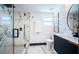 Modern bathroom featuring a glass-enclosed shower, marble tiling, and contemporary vanity at 2536 Burlington N Ave, St Petersburg, FL 33713