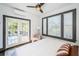 Bright bedroom featuring french doors to a deck, large windows and contemporary decor at 2536 Burlington N Ave, St Petersburg, FL 33713